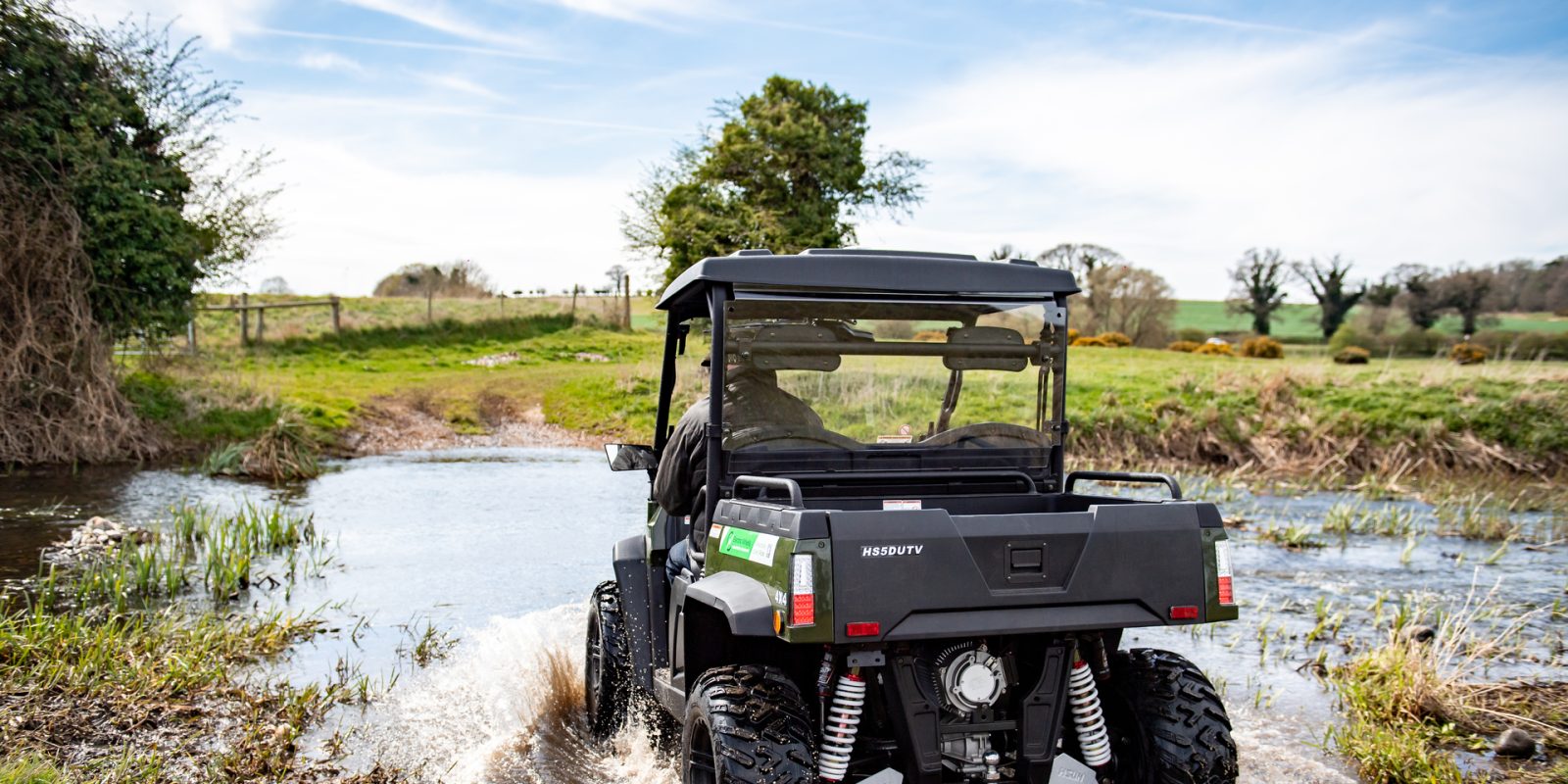 The HiSun Sector 5kW electric 4×4 driving through water